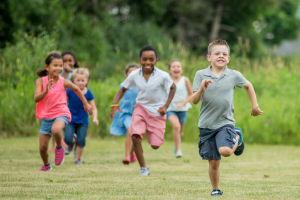 Children playing and running in the park